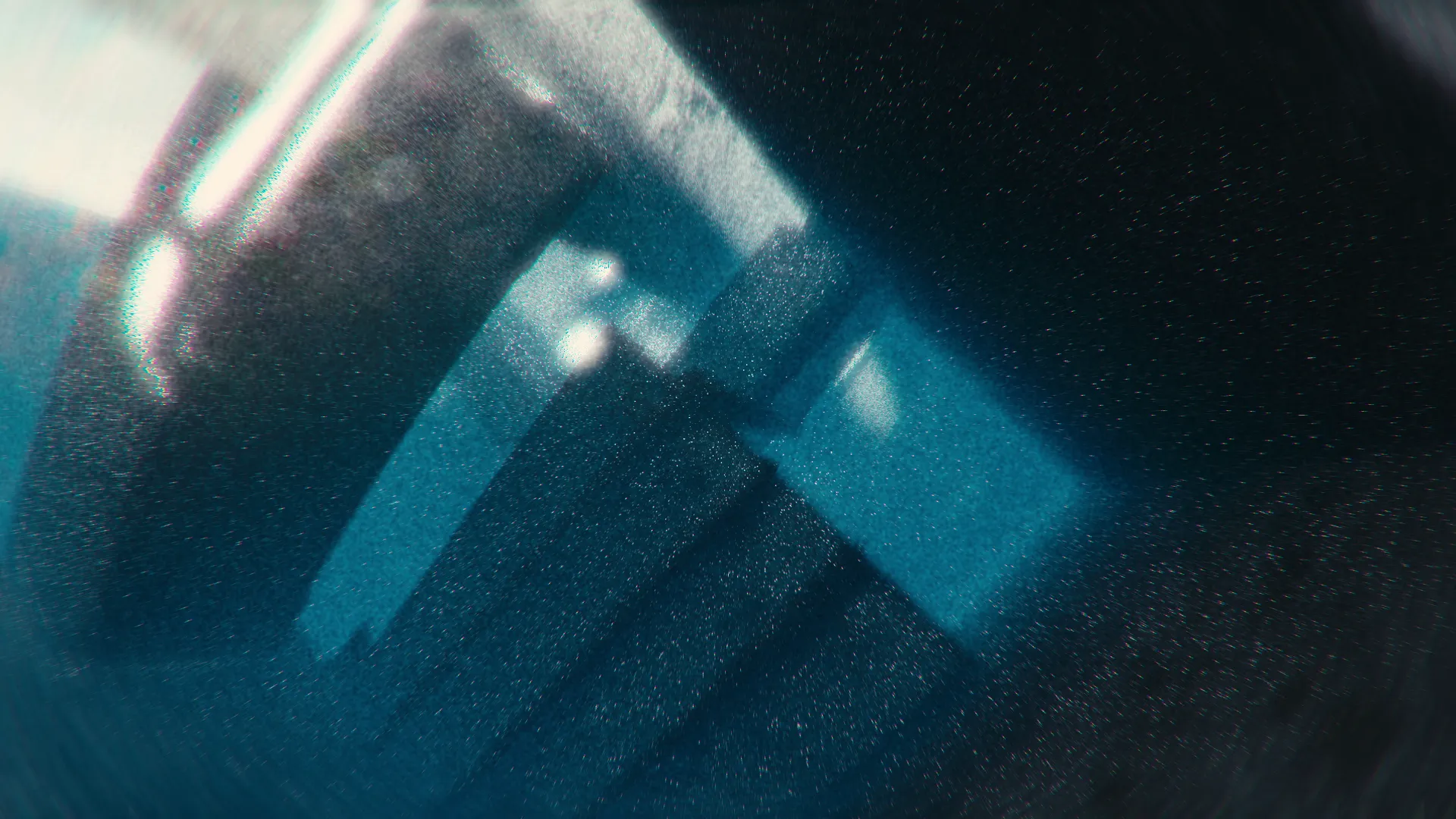 Moody architectural visualization of abstract, blocky structures in a cold, blue light, a minimalist CGI scene focused on form and atmosphere.