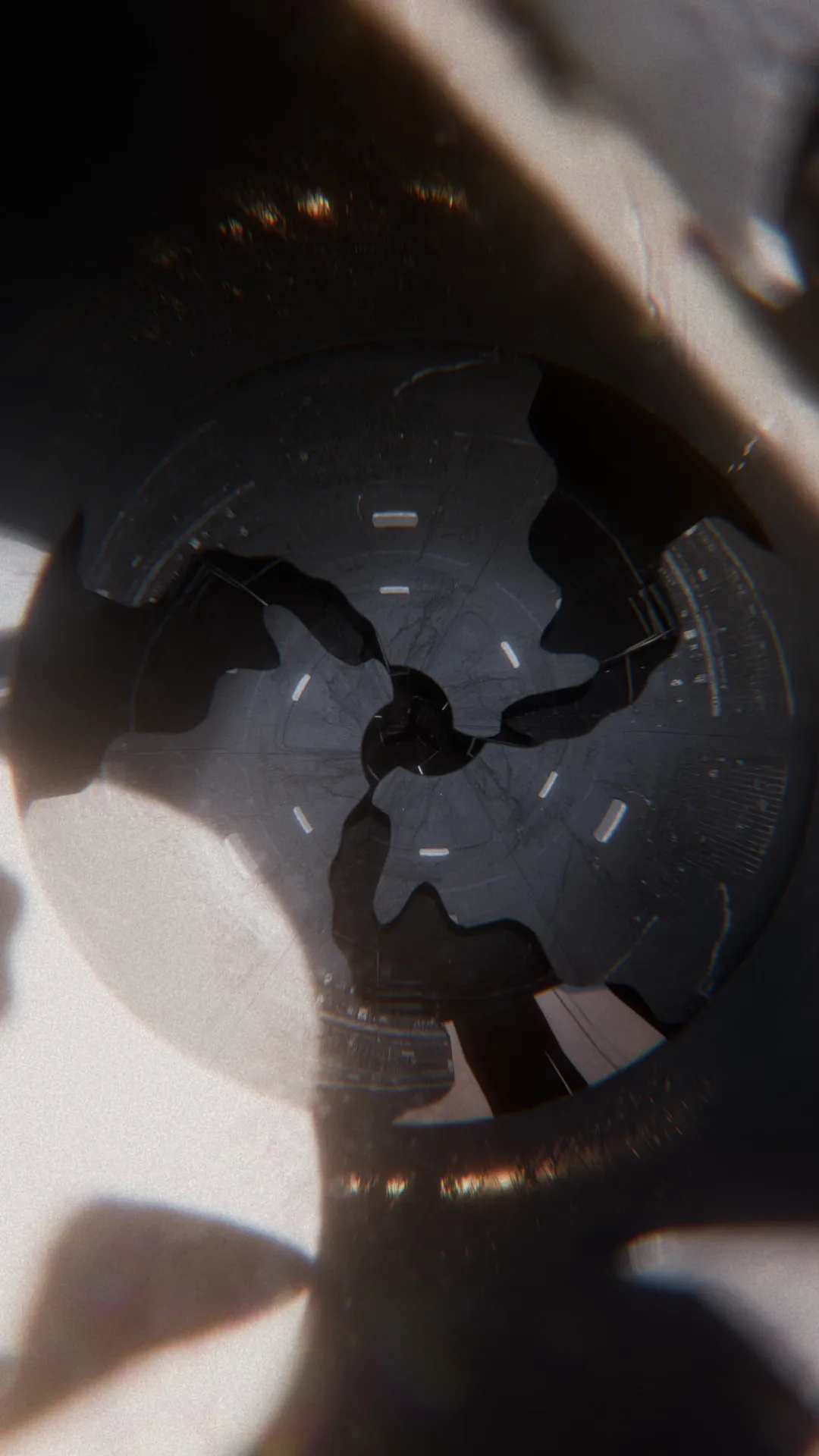 Experimental 3D art of an abstract sculptural form, defined by dramatic, high-contrast lighting that creates sharp highlights and deep shadows.