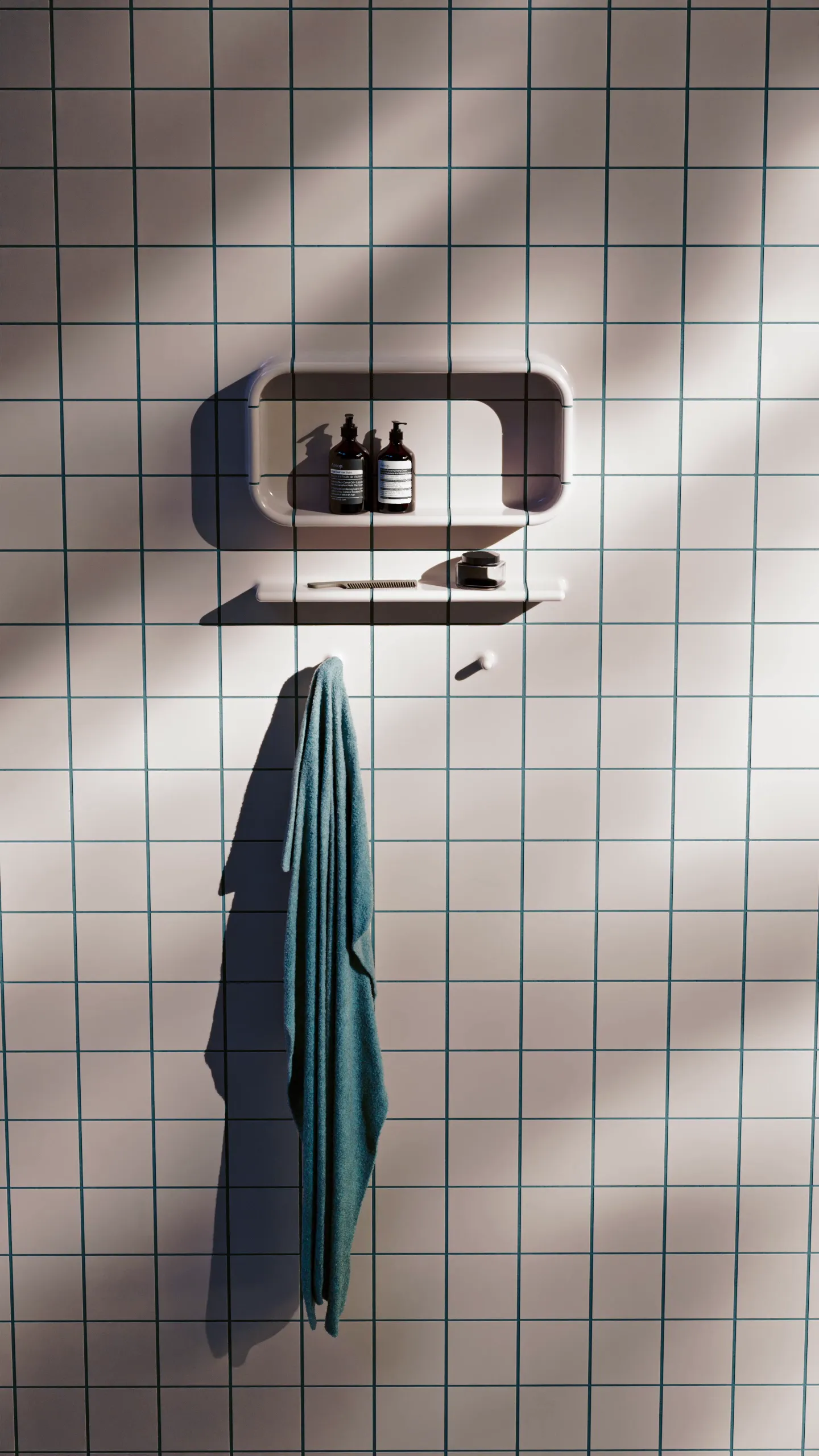 Architectural CGI of tiled wall featuring a shelf, hanging towel, and curated products, demonstrating Tactile collection’s functional detailing and realistic material rendering.